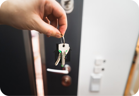 Hand holding house keys